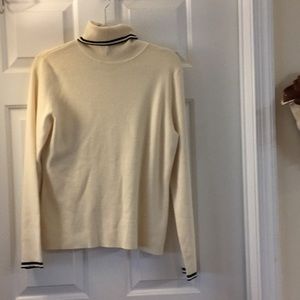 Cream colored turtleneck sweater